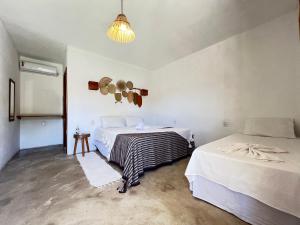 En eller flere senge i et værelse på Hospedaria Passos do Mar, Caraíva + 33 billeder