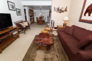 a living room with a couch and a coffee table at Cozy Seven Springs 1 Bedroom Condo with Private Deck condo in Champion