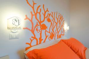 Postel nebo postele na pokoji v ubytování Hotel Maremma Sul Mare