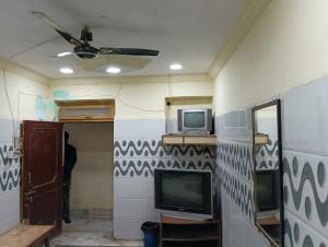 TV i/ili multimedijalni sistem u objektu Hotel Kohinoor Palace
