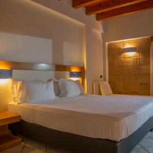 Postel nebo postele na pokoji v ubytování Magaggiari Hotel Resort