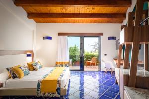 Postel nebo postele na pokoji v ubytování Magaggiari Hotel Resort