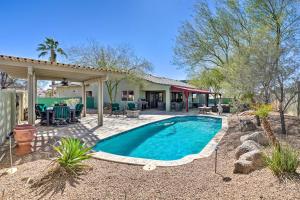 a swimming pool in a yard with a house at Lake Havasu City Vacation Rental with Pool! in Lake Havasu City