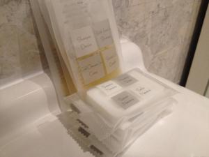 a white phone sitting on top of a toilet at Via Roma suite in Ortona