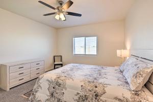 a bedroom with a bed and a ceiling fan at Modern Kingman Vacation Rental, 5 Mi to Dtwn! in Kingman