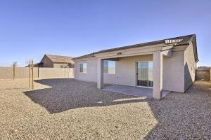 a house with a large garage in a yard at Modern Kingman Vacation Rental, 5 Mi to Dtwn! in Kingman