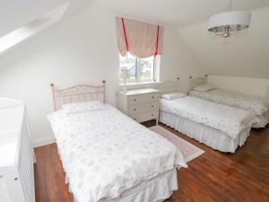Postel nebo postele na pokoji v ubytování Springwood Cottage
