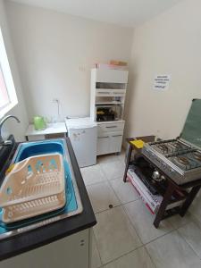 a kitchen with a counter top with a stove top oven at CASA CON COCHERA CERCA A LA PLAYA PlMENTEL in Chiclayo