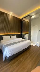 מיטה או מיטות בחדר ב-Villa Ravani Bandung