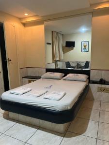 Giường trong phòng chung tại Hotel Bariloche Tijuca Adult Only