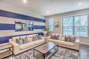 a living room with two couches and a coffee table at N Myrtle Beach Townhome Near Barefoot Resort! in North Myrtle Beach