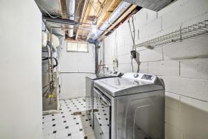 a laundry room with a washing machine and a sink at Charming Vacation Rental 15 Mi to Pittsburgh in Monroeville