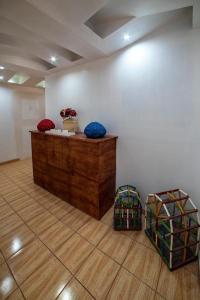 a room with a wooden counter in a room at Hostal Casa Pajaritos in Taxco de Alarcón
