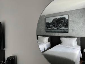 A bed or beds in a room at ALL IN HOTEL