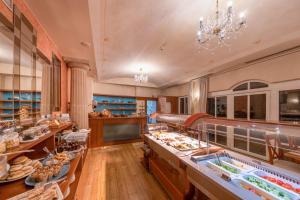 a restaurant with a buffet line with food on display at Hotel Meteor Plaza Prague in Prague