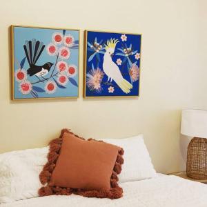 three pictures of birds on a wall above a bed at The Bungalow - Wave Rock Short Stay in Hyden