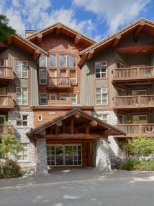 a large building with a large window at Lost Lake Lodge by Whistler Premier in Whistler