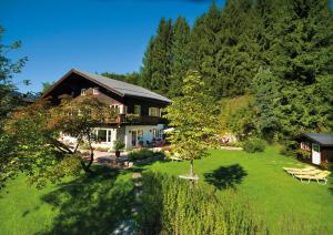 a large house with a yard with a yard at Chalet Lerch in Sankt Johann im Pongau