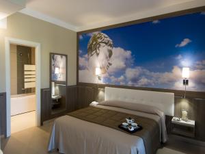 Postel nebo postele na pokoji v ubytování Eracle Hotel