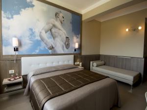Postel nebo postele na pokoji v ubytování Eracle Hotel