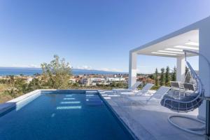 a villa with a swimming pool with a view at Panoramic Villa #1 in Hanioti
