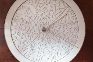 a clock with a lot of numbers on it at COMO Metropolitan London in London