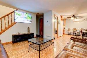 a living room with a couch and a glass table at Honey Spot in Springfield