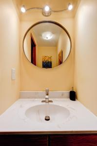 a bathroom with a sink and a mirror at Honey Spot in Springfield