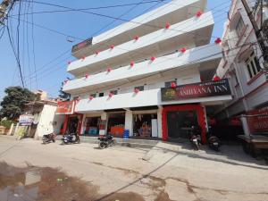 a building with motorcycles parked in front of it at The Ashiyana Inn Hotel in Patna