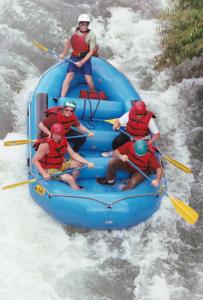 a group of people in a raft in the water at Hacienda Primavera Wilderness Ecolodge in Ambuquí