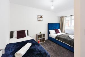 Ένα ή περισσότερα κρεβάτια σε δωμάτιο στο Stylish Home From Home in Leeds