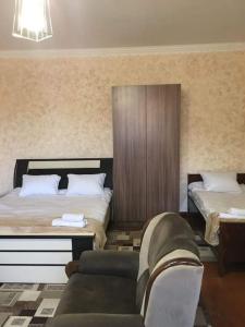 מיטה או מיטות בחדר ב-Norik guest house