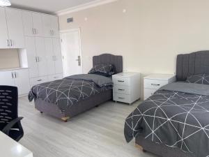 מיטה או מיטות בחדר ב-Eren Rezidans