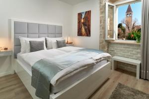 Postel nebo postele na pokoji v ubytování Bernardi Rooms