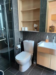 a bathroom with a toilet and a sink and a shower at NJ Homestay @ Colony By Infinitum in Kuala Lumpur