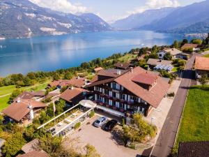 an aerial view of a house with a lake at Eva's Seeblick in Krattigen