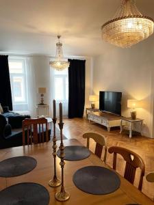 a living room with a table and chairs and a living room at historical Zaffir house - market square in Levoča