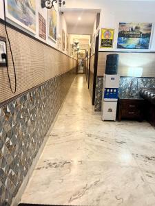 a long aisle in a fast food restaurant with tile walls at House Of Comfort Delhi in New Delhi