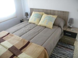 Cama o camas de una habitación en Tejas Apartamento