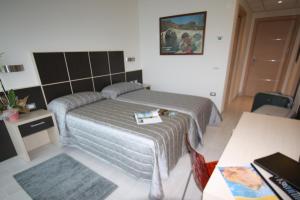 Letto o letti in una camera di Hotel Garnì Corallo