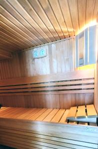 an empty sauna with two benches in it at Villa Eris Amalfi Coast in Conca dei Marini