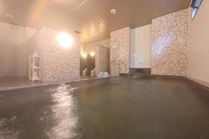 an empty room with a concrete floor in a building at Hotel Keihan Sapporo in Sapporo