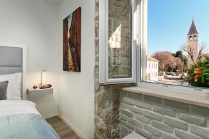 Postel nebo postele na pokoji v ubytování Bernardi Rooms + 7 fotografií