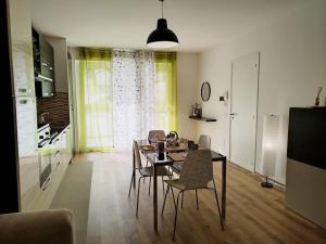 a living room with a dining room table and chairs at Casa Phimes in Calatafimi