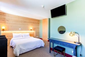 Voodi või voodid majutusasutuse HOTEL TURAN toas