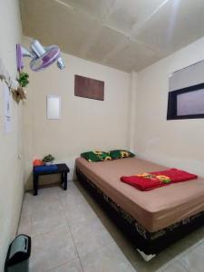 Postel nebo postele na pokoji v ubytování Ijen Basecamp & Homestay