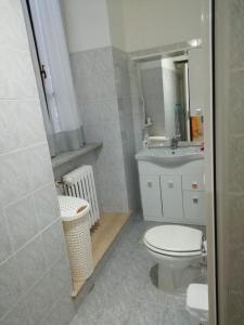 a bathroom with a toilet and a sink at Casa Marina in Orvieto +19 photos