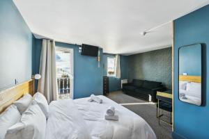 Voodi või voodid majutusasutuse HOTEL TURAN toas