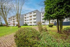 an apartment building in the middle of a park at Modern Apartment near Bottrop in Gladbeck