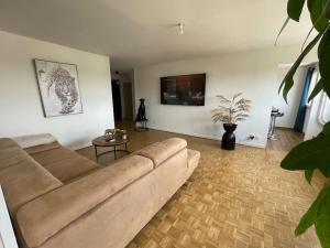 Coin salon dans l'établissement Appartement EPINAL calme